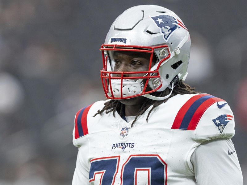 New England Patriots defensive lineman Jeremiah Pharms, Jr. (70) warms up before playing against the Las Vegas Raiders in an NFL football game, Sunday, Oct. 15, 2023, in Las Vegas, NV. Raiders won 21-17. (AP Photo/Jeff Lewis)