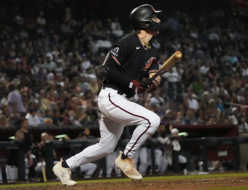 Jun 17, 2023; Phoenix, Arizona, USA; Arizona Diamondbacks' Jake McCarthy (31) hits a home run against the Cleveland Guardians at Chase Field. Mandatory Credit: Joe Rondone-USA TODAY Sports