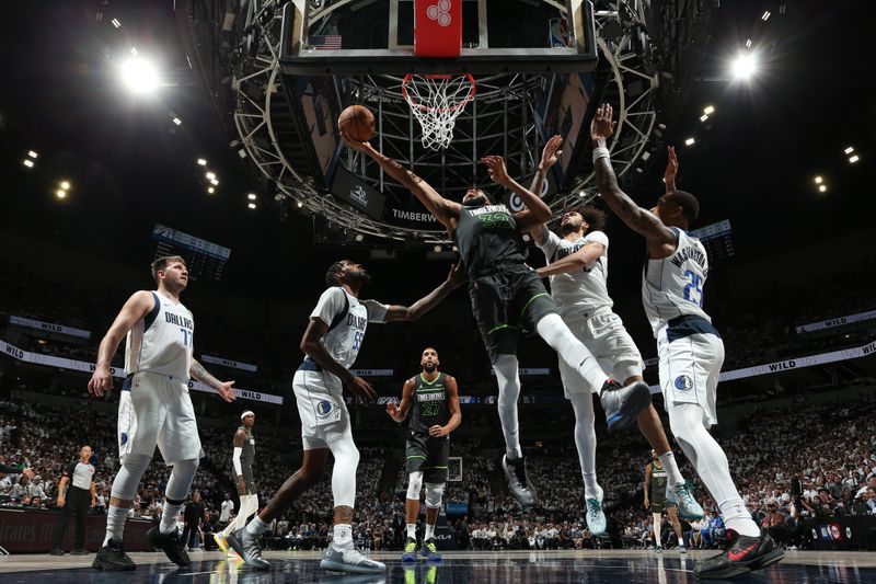 MINNEAPOLIS, MN - MAY 30: Karl-Anthony Towns #32 of the Minnesota Timberwolves drives to the basket during the game against the Dallas Mavericks during Game 5 of the Western Conference Finals during the 2024 NBA Playoffs on May 30, 2024 at Target Center in Minneapolis, Minnesota. NOTE TO USER: User expressly acknowledges and agrees that, by downloading and or using this Photograph, user is consenting to the terms and conditions of the Getty Images License Agreement. Mandatory Copyright Notice: Copyright 2024 NBAE (Photo by David Sherman/NBAE via Getty Images)