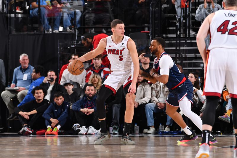 INGLEWOOD, CA - JANUARY 13:  Nikola Jovic #5 of the Miami Heat dribbles the ball during the game against the LA Clippers on January 13, 2025 at Intuit Dome in Los Angeles, California. NOTE TO USER: User expressly acknowledges and agrees that, by downloading and/or using this Photograph, user is consenting to the terms and conditions of the Getty Images License Agreement. Mandatory Copyright Notice: Copyright 2025 NBAE (Photo by Juan Ocampo/NBAE via Getty Images)