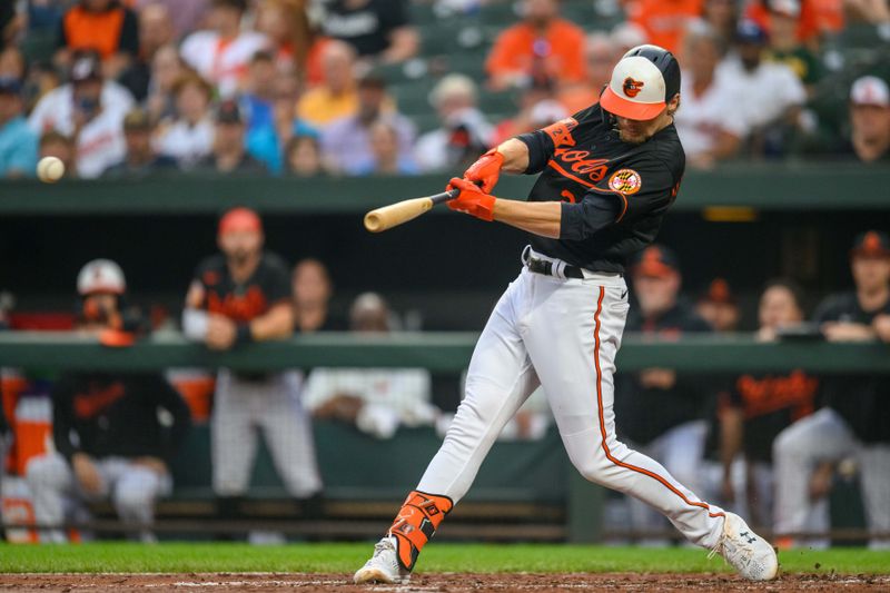 Jun 28, 2023; Baltimore, Maryland, USA; Baltimore Orioles third baseman Gunnar Henderson (2) hits a triple during the first inning against the Cincinnati Reds at Oriole Park at Camden Yards. Mandatory Credit: Reggie Hildred-USA TODAY Sports