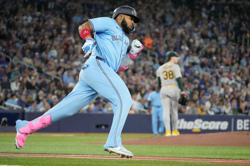 Jun 1, 2025; Toronto, Ontario, CAN; Toronto Blue Jays designated hitter Vladimir Guerrero (27) runs out a double against the Oakland Athletics during the first inning at Rogers Centre. Mandatory Credit: John E. Sokolowski-Imagn Images