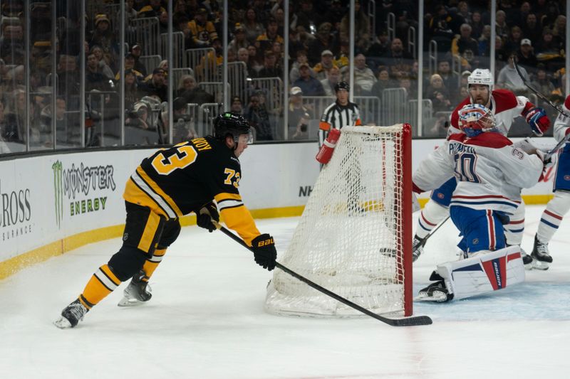 Dec 1, 2024; Boston, Massachusetts, USA; Boston Bruins defenseman Charlie McAvoy (73) scores on Montreal Canadiens goaltender Cayden Primeau (30) in the first period of a game at the TD Garden. Mandatory Credit: Natalie Reid-Imagn Images