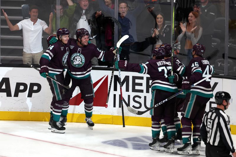 Oct 22, 2023; Anaheim, California, USA;  Anaheim Ducks center Mason McTavish (23) celebrates with teammates after scoring a goal during the third period against the Boston Bruins at Honda Center. Mandatory Credit: Kiyoshi Mio-USA TODAY Sports