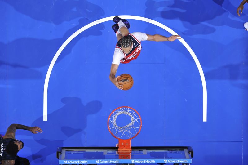 ORLANDO, FL - NOVMEBER 10: Kyshawn George #18 of the Washington Wizards goes up for the rebound during the game against the Orlando Magic on November 10, 2024 at Kia Center in Orlando, Florida. NOTE TO USER: User expressly acknowledges and agrees that, by downloading and or using this photograph, User is consenting to the terms and conditions of the Getty Images License Agreement. Mandatory Copyright Notice: Copyright 2024 NBAE (Photo by Fernando Medina/NBAE via Getty Images)