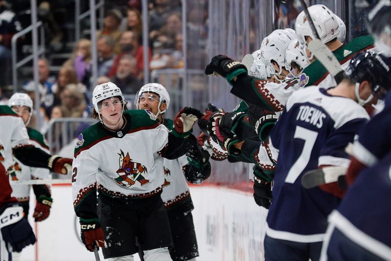 Feb 18, 2024; Denver, Colorado, USA; Arizona Coyotes center Logan Cooley (92) celebrates with the bench after his goal in the second period against the Colorado Avalanche at Ball Arena. Mandatory Credit: Isaiah J. Downing-USA TODAY Sports