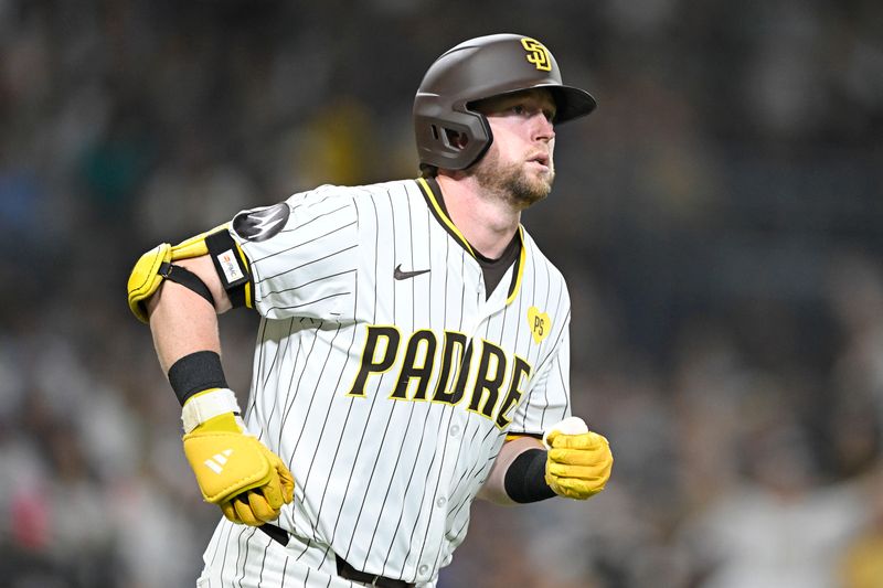 Jun 9, 2024; San Diego, California, USA; San Diego Padres first baseman Jake Cronenworth (9) rounds the bases after hitting a solo home run during the seventh inning against the Seattle Mariners at Petco Park. Mandatory Credit: Denis Poroy-USA TODAY Sports at Petco Park. 