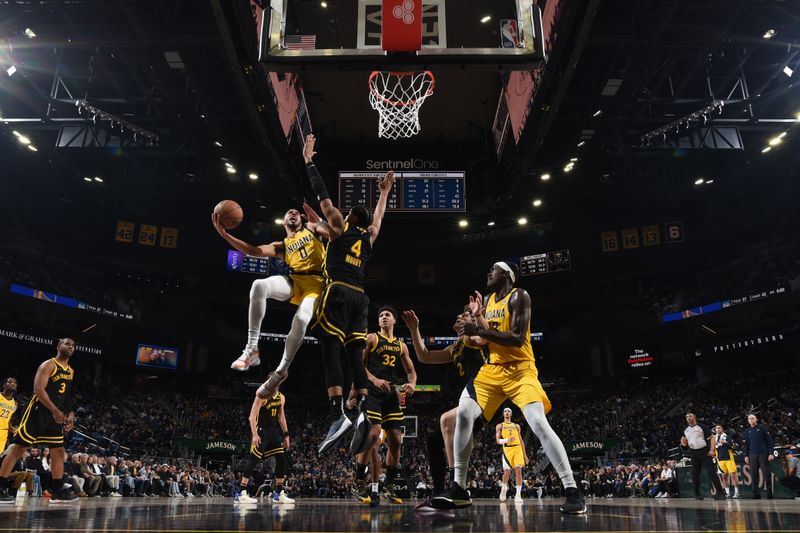 SAN FRANCISCO, CA - MARCH 22: Tyrese Haliburton #0 of the Indiana Pacers drives to the basket during the game against the Golden State Warriors on March 22, 2024 at Chase Center in San Francisco, California. NOTE TO USER: User expressly acknowledges and agrees that, by downloading and or using this photograph, user is consenting to the terms and conditions of Getty Images License Agreement. Mandatory Copyright Notice: Copyright 2024 NBAE (Photo by Noah Graham/NBAE via Getty Images)