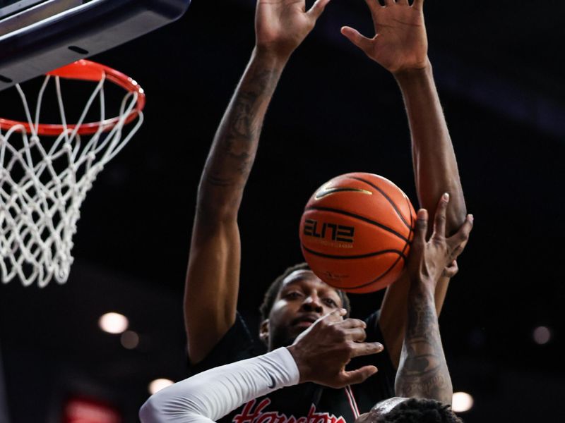 Feb 15, 2025; Tucson, Arizona, USA; Houston Cougars forward Ja’Vier Francis (5) fouls Arizona Wildcats guard Caleb Love (1) during the second half at McKale Center. Mandatory Credit: Aryanna Frank-Imagn Images