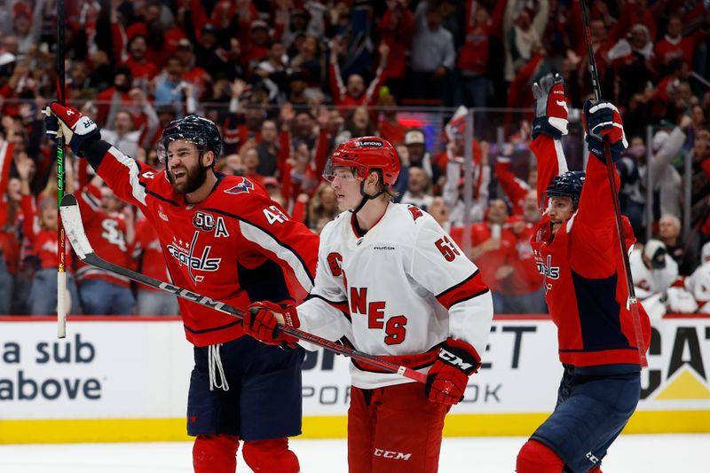 May 8, 2025; Washington, District of Columbia, USA; Washington Capitals right wing Tom Wilson (43) celebrates after scoring an empty net goal as Carolina Hurricanes right wing Jackson Blake (53) looks on in the third period in game two of the second round of the 2025 Stanley Cup Playoffs at Capital One Arena. Mandatory Credit: Geoff Burke-Imagn Images