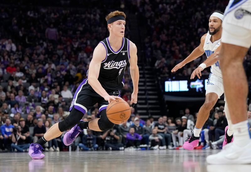 SACRAMENTO, CALIFORNIA - JANUARY 03: Kevin Huerter #9 of the Sacramento Kings dribbling the ball looks to drive towards the basket against the Orlando Magic during the first half of an NBA basketball game at Golden 1 Center on January 03, 2024 in Sacramento, California. NOTE TO USER: User expressly acknowledges and agrees that, by downloading and or using this photograph, User is consenting to the terms and conditions of the Getty Images License Agreement. (Photo by Thearon W. Henderson/Getty Images)