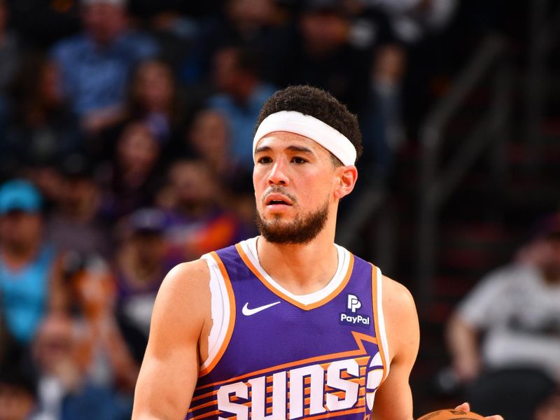 PHOENIX, AZ - MARCH 21:  Devin Booker #1 of the Phoenix Suns handles the ball during the game  on March 21, 2024 at Footprint Center in Phoenix, Arizona. NOTE TO USER: User expressly acknowledges and agrees that, by downloading and or using this photograph, user is consenting to the terms and conditions of the Getty Images License Agreement. Mandatory Copyright Notice: Copyright 2024 NBAE (Photo by Barry Gossage/NBAE via Getty Images)