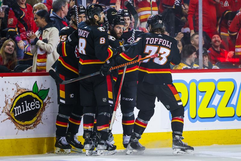 Feb 28, 2023; Calgary, Alberta, CAN; Calgary Flames center Dillon Dube (29) celebrates his goal with teammates against the Boston Bruins during the third period at Scotiabank Saddledome. Mandatory Credit: Sergei Belski-USA TODAY Sports