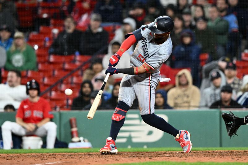 Sep 20, 2024; Boston, Massachusetts, USA; Minnesota Twins second baseman Willi Castro (50) hits a RBI single against the Boston Red Sox during the 12th inning at Fenway Park. Mandatory Credit: Brian Fluharty-Imagn Images