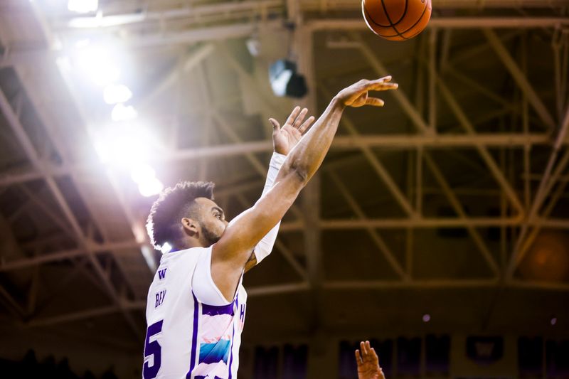 Feb 18, 2023; Seattle, Washington, USA; Washington Huskies guard Jamal Bey (5) attempts a three-pointer against the Oregon State Beavers during the second half at Alaska Airlines Arena at Hec Edmundson Pavilion. Mandatory Credit: Joe Nicholson-USA TODAY Sports