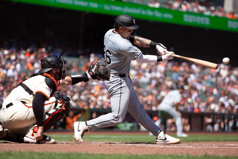 Aug 21, 2024; San Francisco, California, USA; Chicago White Sox catcher Korey Lee (26) hits a two-RBI single against the San Francisco Giants during the ninth inning at Oracle Park. Mandatory Credit: D. Ross Cameron-USA TODAY Sports