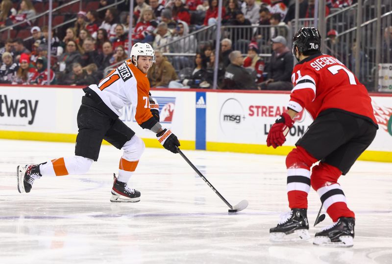 Dec 19, 2023; Newark, New Jersey, USA; Philadelphia Flyers right wing Tyson Foerster (71) skates with the puck while being defended by New Jersey Devils defenseman Jonas Siegenthaler (71) during the first period at Prudential Center. Mandatory Credit: Ed Mulholland-USA TODAY Sports