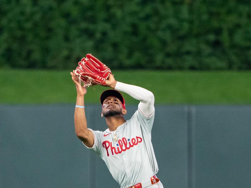 Jul 22, 2024; Minneapolis, Minnesota, USA; Philadelphia Phillies center fielder Johan Rojas (18) catches a fly ball against the Minnesota Twins in the fifth inning at Target Field. Mandatory Credit: Jesse Johnson-USA TODAY Sports