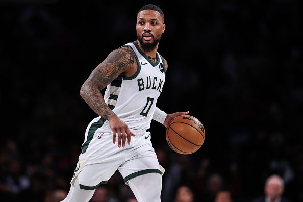 NEW YORK, NEW YORK - DECEMBER 27: Damian Lillard #0 of the Milwaukee Bucks brings the ball up the court during the first quarter of the game against the Brooklyn Nets at Barclays Center on December 27, 2023 in New York City. NOTE TO USER: User expressly acknowledges and agrees that, by downloading and or using this photograph, User is consenting to the terms and conditions of the Getty Images License Agreement. (Photo by Dustin Satloff/Getty Images)