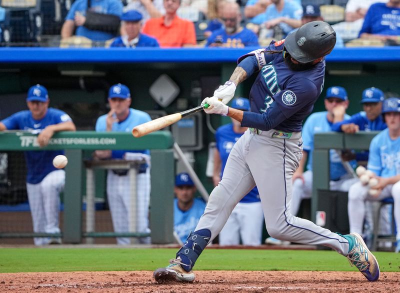 Sep 18, 2025; Kansas City, Missouri, USA; Seattle Mariners shortstop J.P. Crawford (3) hits a one run double against the Kansas City Royals during the eighth inning at Kauffman Stadium. Mandatory Credit: Denny Medley-Imagn Images