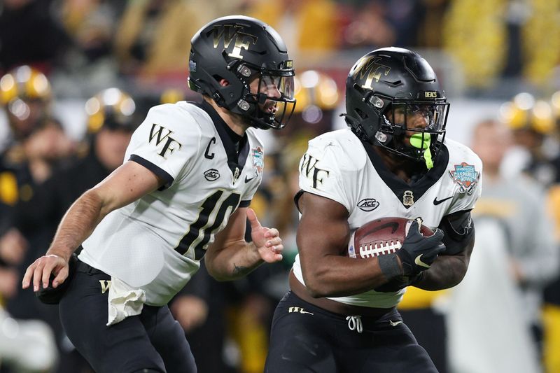 Dec 23, 2022; Tampa, Florida, USA; Wake Forest Demon Deacons running back Justice Ellison (6) runs with the ball against the Missouri Tigers in the second quarter in the 2022 Gasparilla Bowl at Raymond James Stadium. Mandatory Credit: Nathan Ray Seebeck-USA TODAY Sports