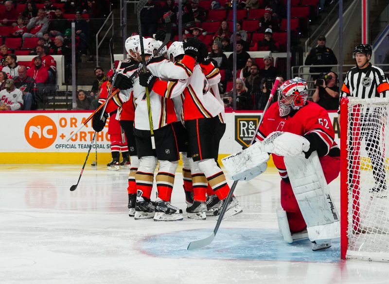 Jan 11, 2024; Raleigh, North Carolina, USA; Anaheim Ducks center Isac Lundestrom (21) celebrates his goal against Carolina Hurricanes goaltender Pyotr Kochetkov (52) during the second period at PNC Arena. Mandatory Credit: James Guillory-USA TODAY Sports