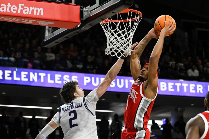 Jan 27, 2024; Evanston, Illinois, USA; Ohio State Buckeyes guard Roddy Gayle Jr. (1) shoots against Northwestern Wildcats forward Nick Martinelli (2) during the first half  at Welsh-Ryan Arena. Mandatory Credit: Matt Marton-USA TODAY Sports