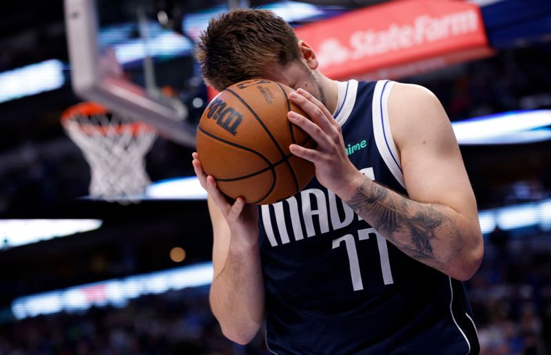 DALLAS, TX - MARCH 5: Luka Doncic #77 of the Dallas Mavericks reacts after a called foul in the second half at American Airlines Center against the Phoenix Suns on March 5, 2023 in Dallas, Texas. The Suns won 130-126. NOTE TO USER: User expressly acknowledges and agrees that, by downloading and or using this photograph, User is consenting to the terms and conditions of the Getty Images License Agreement. (Photo by Ron Jenkins/Getty Images)