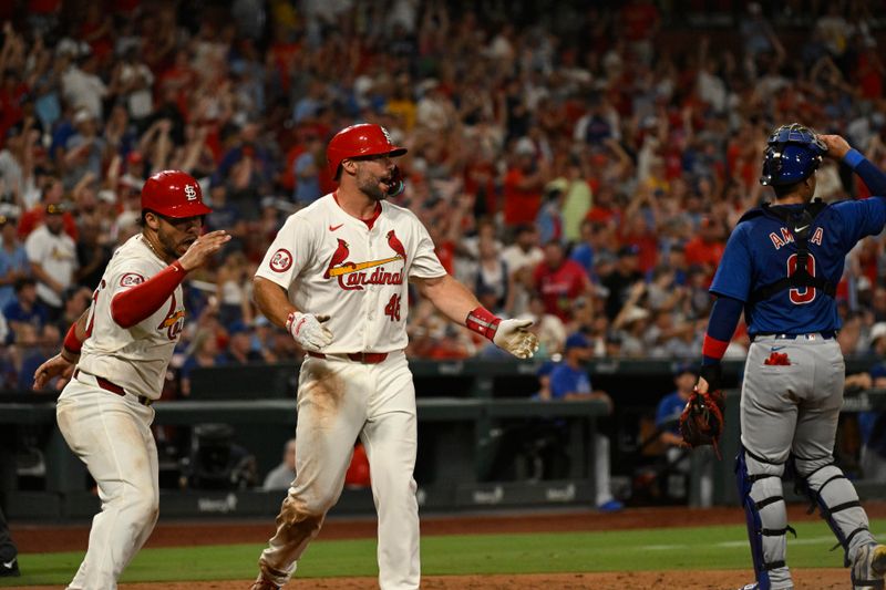 Jul 13, 2024; St. Louis, Missouri, USA; St. Louis Cardinals first baseman Paul Goldschmidt (46) and catcher Willson Contreras (40) react after scoring off a single from third baseman Nolan Arenado (not pictured) against the Chicago Cubs during the eighth inning at Busch Stadium. Mandatory Credit: Jeff Le-USA TODAY Sports