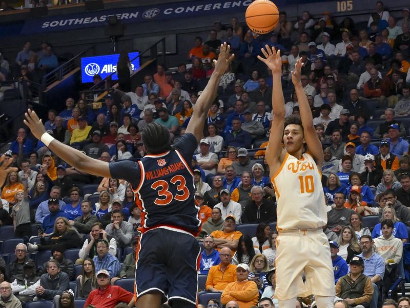 Mar 12, 2026; Nashville, TN, USA;  Tennessee Volunteers forward Nate Ament (10) shoots over Auburn Tigers forward Sebastian Williams-Adams (33) during the first half at Bridgestone Arena. Mandatory Credit: Steve Roberts-Imagn Images