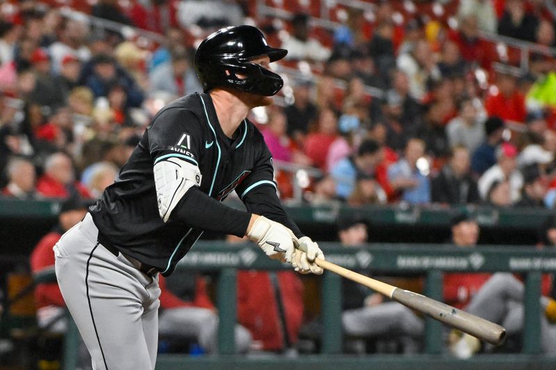 Apr 23, 2024; St. Louis, Missouri, USA;  Arizona Diamondbacks designated hitter Pavin Smith (26) hits a grand slam against the St. Louis Cardinals during the sixth inning at Busch Stadium. Mandatory Credit: Jeff Curry-USA TODAY Sports