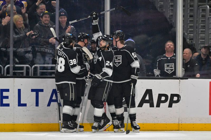 Mar 3, 2024; Los Angeles, California, USA;  Los Angeles Kings celebrate after a goal by center Phillip Danault (24) in the first period against the New Jersey Devils at Crypto.com Arena. Mandatory Credit: Jayne Kamin-Oncea-USA TODAY Sports