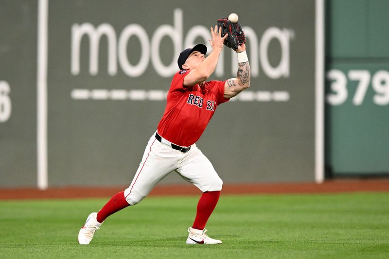 Sep 6, 2024; Boston, Massachusetts, USA; Boston Red Sox left fielder Tyler O'Neill (17) makes a catch for an out during the fifth inning of a game against the Chicago White Sox at Fenway Park. Mandatory Credit: Brian Fluharty-Imagn Images