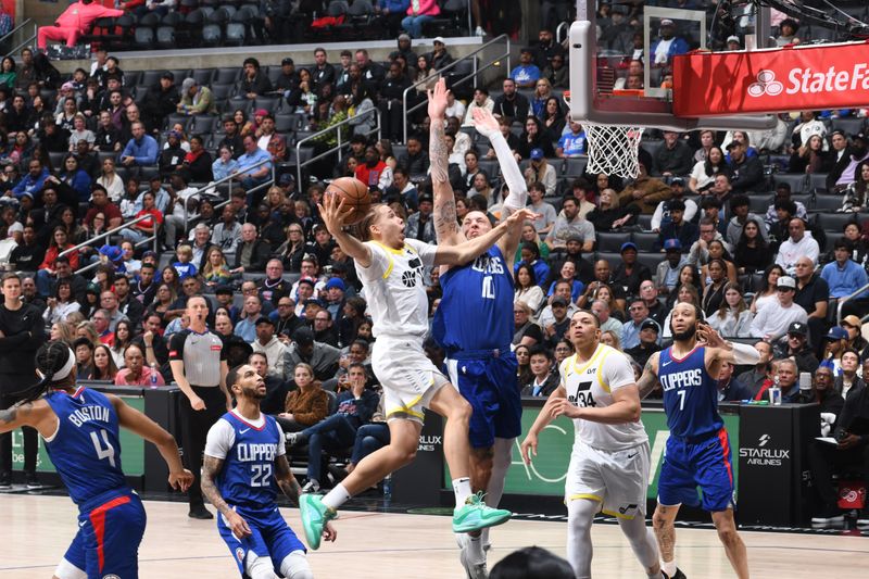 LOS ANGELES, CA - APRIL 12: Jason Preston #10 of the Utah Jazz drives to the basket during the game against the LA Clippers on April 12, 2024 at Crypto.Com Arena in Los Angeles, California. NOTE TO USER: User expressly acknowledges and agrees that, by downloading and/or using this Photograph, user is consenting to the terms and conditions of the Getty Images License Agreement. Mandatory Copyright Notice: Copyright 2024 NBAE (Photo by Adam Pantozzi/NBAE via Getty Images)