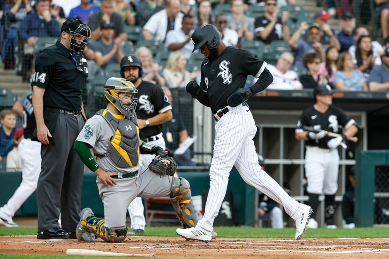 Aug 26, 2023; Chicago, Illinois, USA; Chicago White Sox center fielder Luis Robert Jr. (88) scores against the Oakland Athletics during the first inning at Guaranteed Rate Field. Mandatory Credit: Kamil Krzaczynski-USA TODAY Sports