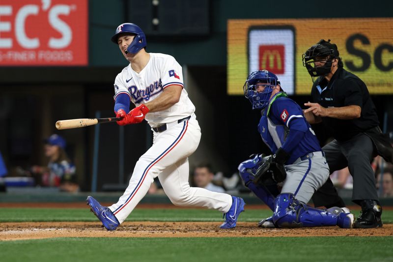 Jun 22, 2024; Arlington, Texas, USA; Texas Rangers left fielder Wyatt Langford (36) reacts after hitting a bal off his foot in the eighth inning against the Kansas City Royals at Globe Life Field. Mandatory Credit: Tim Heitman-USA TODAY Sports