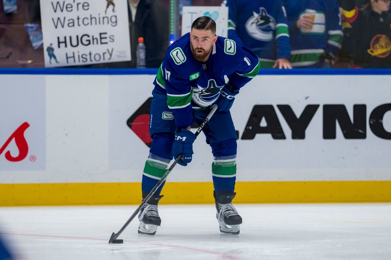 Nov 12, 2024; Vancouver, British Columbia, CAN; Vancouver Canucks defenseman Filip Hronek (17) warms up prior to a game against the Calgary Flames at Rogers Arena. Mandatory Credit: Bob Frid-Imagn Images