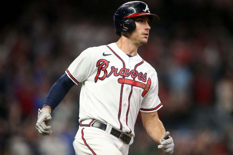 Oct 12, 2022; Atlanta, Georgia, USA; Atlanta Braves first baseman Matt Olson (28) watches his RBI single against the Philadelphia Phillies in the sixth inning during game two of the NLDS for the 2022 MLB Playoffs at Truist Park. Mandatory Credit: Brett Davis-USA TODAY Sports