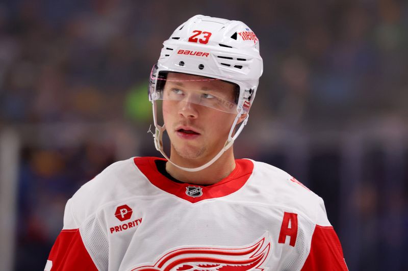 Oct 22, 2025; Buffalo, New York, USA;  Detroit Red Wings left wing Lucas Raymond (23) waits for the face-off during the first period against the Buffalo Sabres at KeyBank Center. Mandatory Credit: Timothy T. Ludwig-Imagn Images
