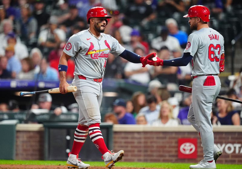 Sep 25, 2024; Denver, Colorado, USA; St. Louis Cardinals catcher Ivan Herrera (48) celebrates scoring a run with center fielder Michael Siani (63) in the sixth inning against the Colorado Rockies at Coors Field. Mandatory Credit: Ron Chenoy-Imagn Images