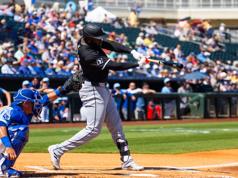 Mar 21, 2024; Surprise, Arizona, USA; Chicago White Sox outfielder Luis Robert Jr. against the Kansas City Royals during a spring training baseball game at Surprise Stadium. Mandatory Credit: Mark J. Rebilas-USA TODAY Sports