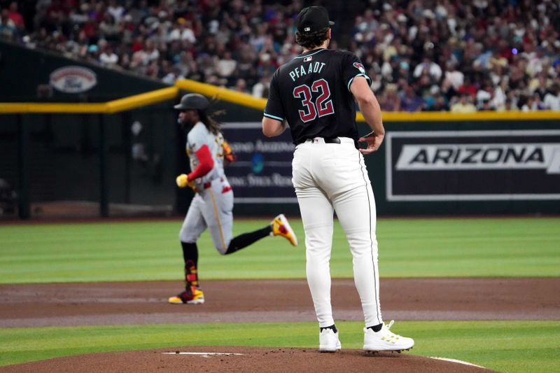 Jul 27, 2024; Phoenix, Arizona, USA; Arizona Diamondbacks pitcher Brandon Pfaadt (32) reacts after giving up a solo home run to Pittsburgh Pirates shortstop Oneil Cruz (15) during the first inning at Chase Field. Mandatory Credit: Joe Camporeale-USA TODAY Sports