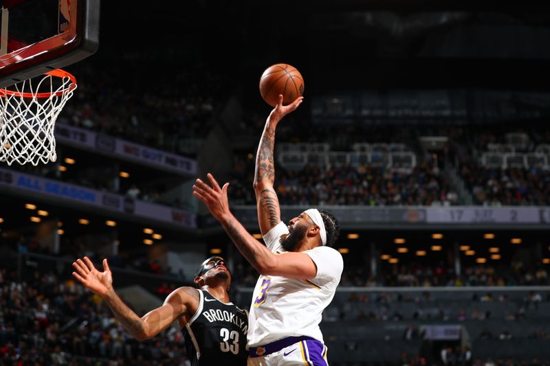 BROOKLYN, NY - MARCH 31: Anthony Davis #3 of the Los Angeles Lakers goes to the basket during the game on March 31, 2024 at Barclays Center in Brooklyn, New York. NOTE TO USER: User expressly acknowledges and agrees that, by downloading and or using this Photograph, user is consenting to the terms and conditions of the Getty Images License Agreement. Mandatory Copyright Notice: Copyright 2024 NBAE (Photo by David L. Nemec/NBAE via Getty Images)