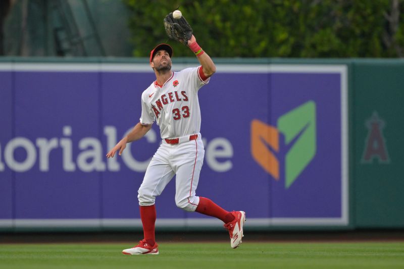 May 26, 2025; Anaheim, California, USA;  New York Yankees second baseman Jorbit Vivas (90) flies out to Los Angeles Angels center fielder Chris Taylor (33) in the third inning at Angel Stadium. Mandatory Credit: Jayne Kamin-Oncea-Imagn Images