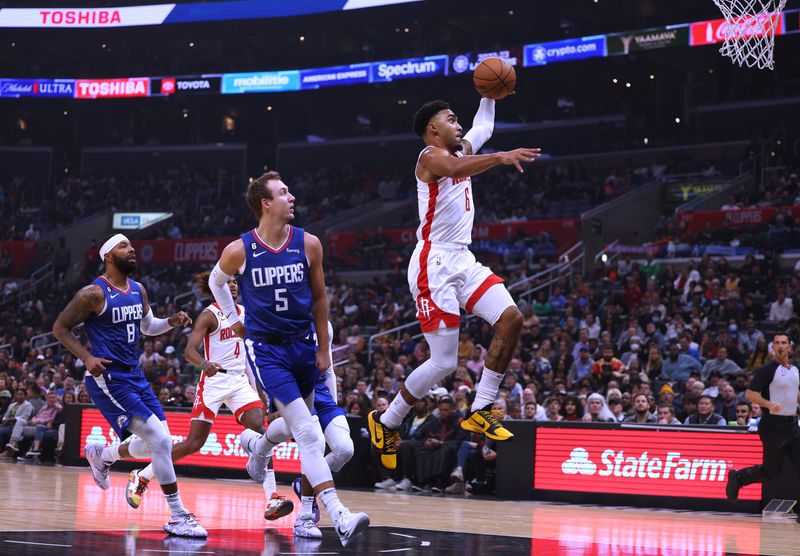 LOS ANGELES, CALIFORNIA - OCTOBER 31: Kenyon Martin Jr. #6 of the Houston Rockets dunks in front of Luke Kennard #5 and Marcus Morris Sr. #8 of the LA Clippers during the first half at Crypto.com Arena on October 31, 2022 in Los Angeles, California. NOTE TO USER: User expressly acknowledges and agrees that, by downloading and/or using this Photograph, user is consenting to the terms and conditions of the Getty Images License Agreement. Mandatory Copyright Notice: Copyright 2022 NBAE (Photo by Harry How/Getty Images)