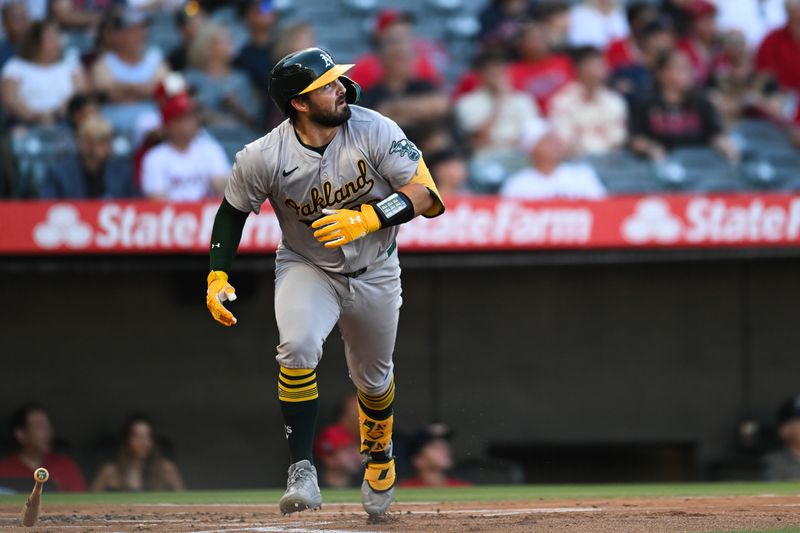 Jul 27, 2024; Anaheim, California, USA; Oakland Athletics catcher Shea Langeliers (23) hits a three-run home run against the Los Angeles Angels during the first inning at Angel Stadium. Mandatory Credit: Jonathan Hui-USA TODAY Sports