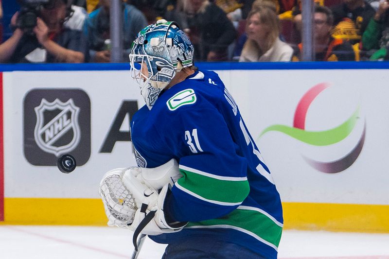 Sep 24, 2024; Vancouver, British Columbia, CAN; Vancouver Canucks goalie Arturs Silovs (31) makes a save against the Seattle Kraken during the second period at Rogers Arena. Mandatory Credit: Bob Frid-Imagn Images