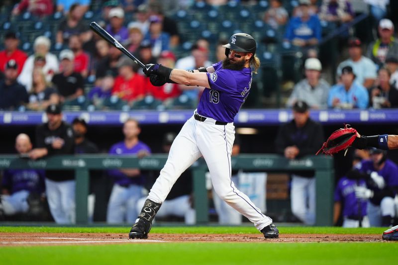 Sep 24, 2024; Denver, Colorado, USA; Colorado Rockies designated hitter Charlie Blackmon (19) swings in the first inning against the St. Louis Cardinals at Coors Field. Mandatory Credit: Ron Chenoy-Imagn Images