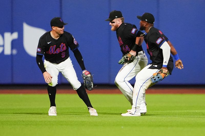 May 31, 2024; New York City, New York, USA; New York Mets left fielder Brandon Nimmo (9) and center fielder Harrison Bader (44) and right fielder Starling Marte (6) celebrate the victory after the ninth inning against the Arizona Diamondbacks at Citi Field. Mandatory Credit: Gregory Fisher-USA TODAY Sports