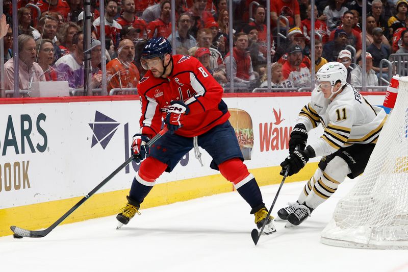 Apr 15, 2024; Washington, District of Columbia, USA; Washington Capitals left wing Alex Ovechkin (8) skates with the puck as Boston Bruins center Trent Frederic (11) defends in the third period at Capital One Arena. Mandatory Credit: Geoff Burke-USA TODAY Sports